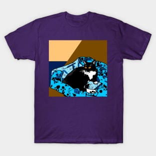 Cute Tuxedo cat laying in a paw print bed T-Shirt